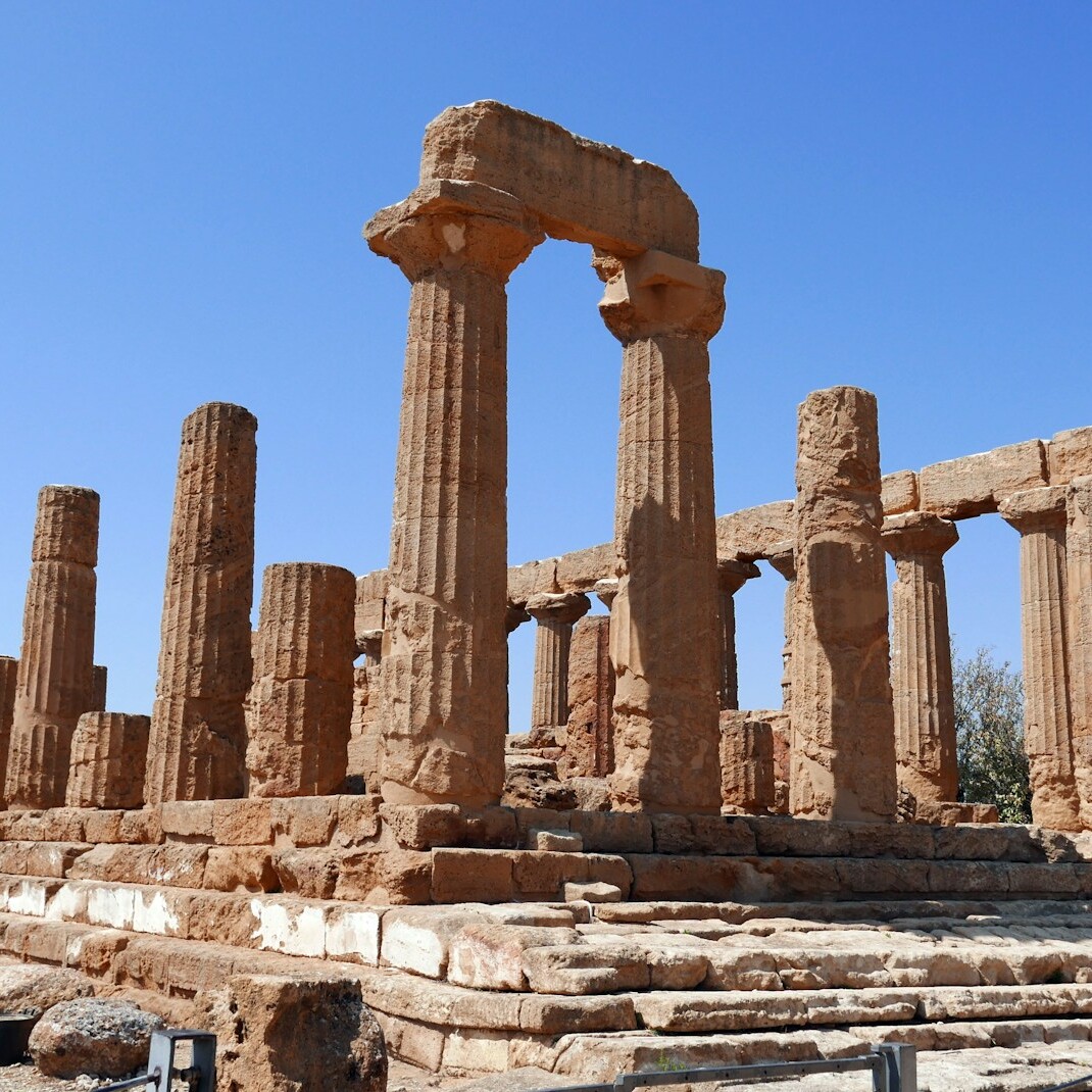 brown concrete pillars under blue sky during daytime