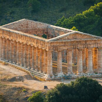 a building with columns and a road